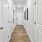 a hallway with white doors