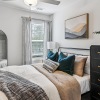 Bedroom with natural lighting and high ceilings