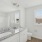 Bathroom with sinks and windows