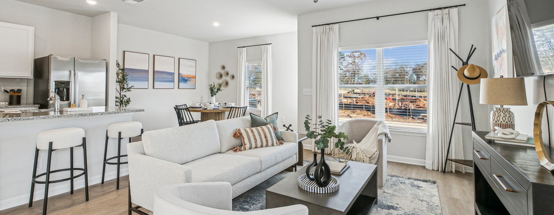 a living room with a couch and a rug