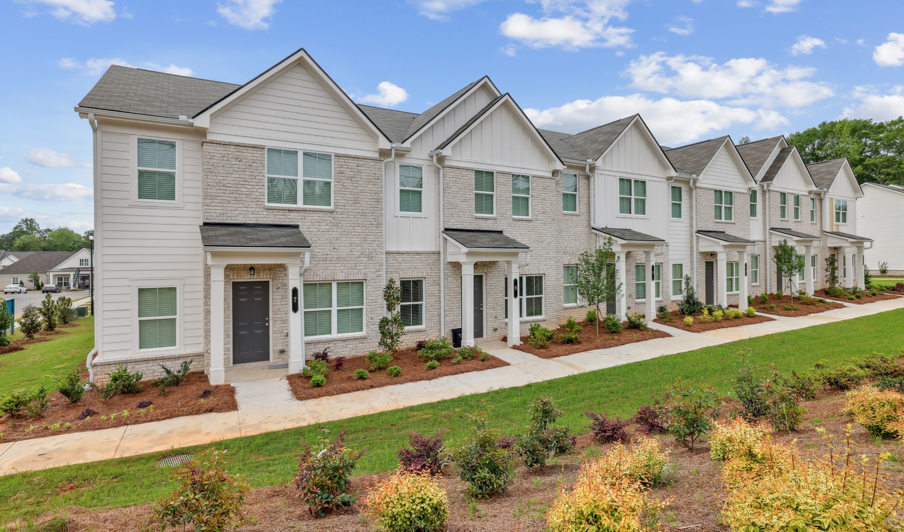 row of towhomes with landscaping